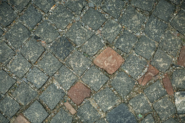 Cracked old stone wall background, grunge texture close up.