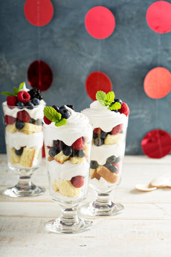 Layered dessert parfait with sweet bread and berries