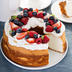 Angel food cake with whipped cream and berries