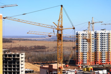 crane and unfinished building