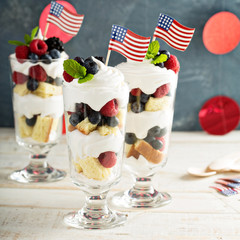 Layered dessert parfait with sweet bread and berries