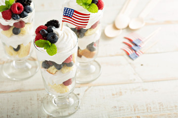 Layered dessert parfait with sweet bread and berries
