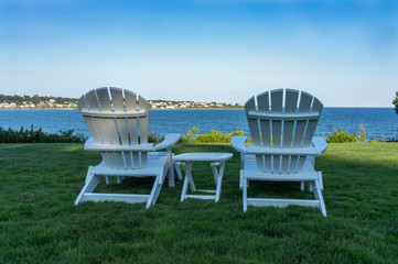 Adirondack chairs relaxing near the ocean in Newport, Rhode Isla