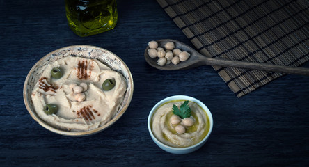 Hummus on a rustic wooden table