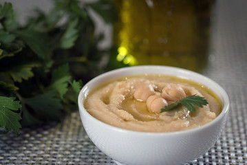 Hummus on a rustic wooden table
