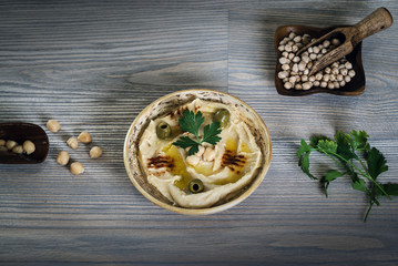Hummus on a rustic wooden table
