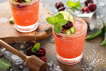 Refreshing summer cocktail with cherry