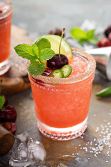 Refreshing summer cocktail with cherry
