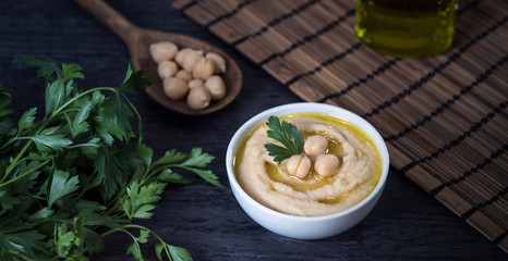 Hummus on a rustic wooden table