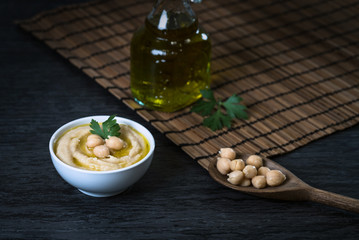 Hummus on a rustic wooden table