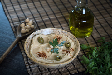 Hummus on a rustic wooden table