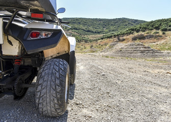 Fototapeta premium ATV offroad on mountain and sky background.