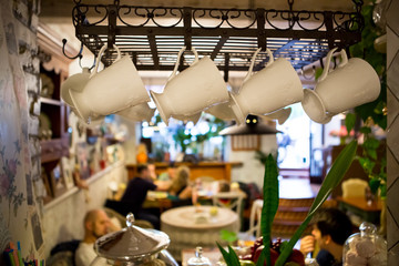 Interior of restaurant in country style. cozy restaurant in French style with empty frames for paintings and photographs on walls
