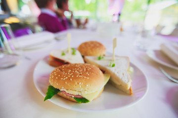 Decorated catering banquet table with different food appetizers assortment on a party
