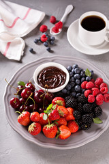 Fresh berries with chocolate sauce for breakfast