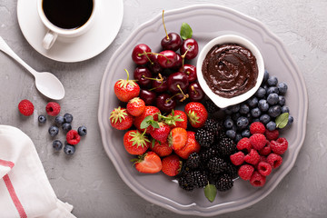 Fresh berries with chocolate sauce for breakfast © fahrwasser