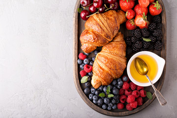 Healthy breakfast with freshly baked croissants and berries