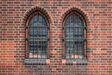 two old windows  , gothic  church building exterior