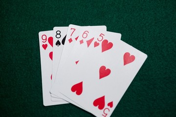 Playing cards arranged on poker table