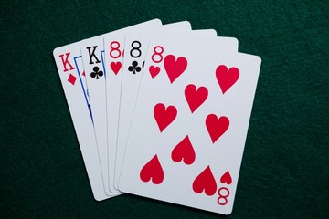 Playing cards arranged on poker table