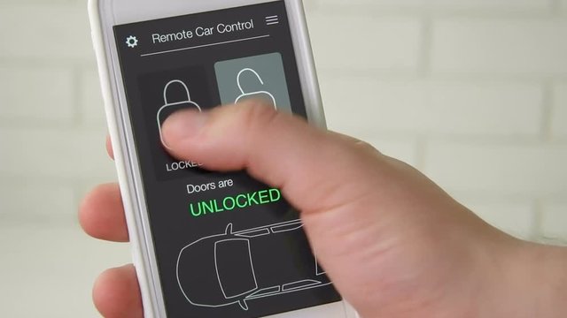 Man remotely locks his car using his mobile device. Car remote control using smartphone application fictional interface.