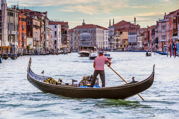 Men In Gondola On Canal In City, Venice, Italy