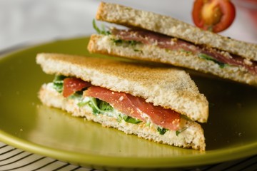 Sandwich with cheese and basil spread and carpaccio
