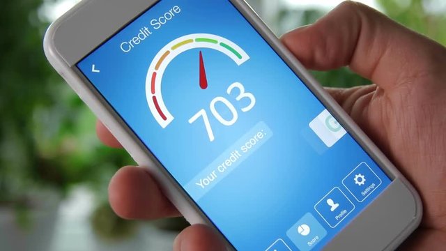 Checking credit score on smartphone using application. The result is GOOD