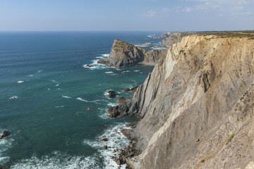 Fototapeta na wymiar Rocky cliffs of Arrifana in Southern Portugal 
