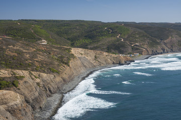 A stony beach and rocky cliffs of Southern Portugal © Pawel Sidlo