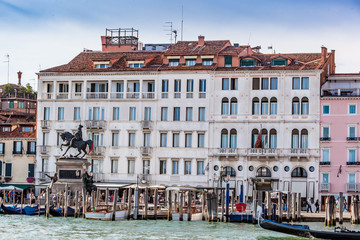 Boats On Canal In City Against Building