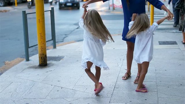Happy mother and little adorable girl in Europe during summer vacation. Family european vacation.