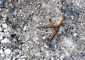 Rusty burnt screws and Fire Ash