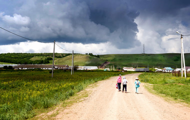 Three Kids Walking Towards a Storm