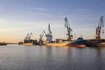 Riga industrial port with ships and cranes