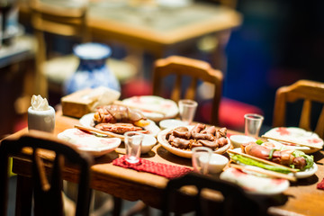 close up Miniature clay figurine Thailand's floating market,Miniature boat carrying tropical fruit on wood background