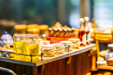 close up Miniature clay figurine Thailand's floating market,Miniature boat carrying tropical fruit on wood background