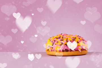 Delicious party cakes with heart shape symbols on colorful background