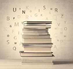 Books with flying letters on vintage background