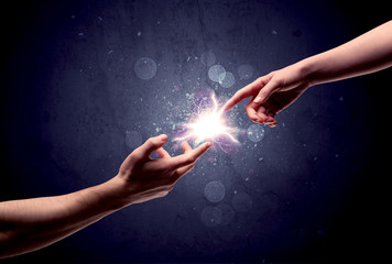 Hands reaching to light a spark