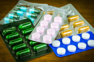 Drug prescription for treatment medication. Pharmaceutical medicament, cure in container for health. Pharmacy theme, capsule pills with medicine antibiotic in packages.