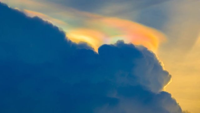 The rainbow clouds are beautifully moving, amazing phenomenon,Time lapse