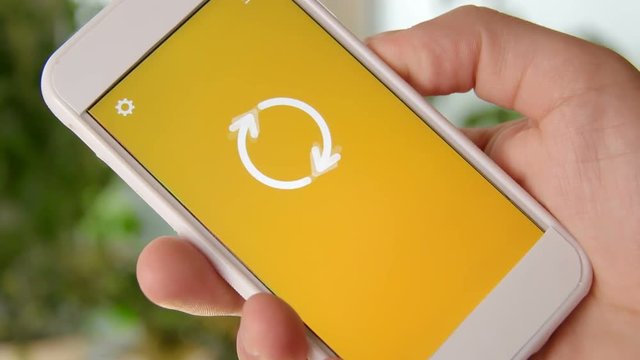 Invoices concept application on the smartphone. Man uses mobile app.