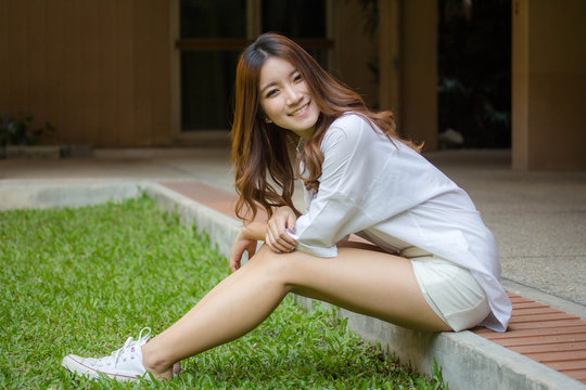 Portrait of thai adult working women white shirt relax and smile