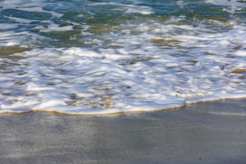 Water over sand in tropical beach