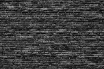 Abwaschbare Fototapete Steine düsterer hintergrund, schwarze backsteinmauer aus dunkler steinstruktur