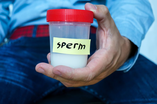 man hands holding sterile sample container bottle