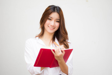 Portrait of thai adult working women white shirt Write book © tiniroma