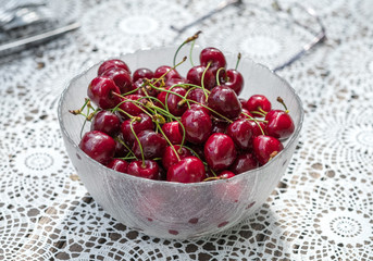Fresh cherries in a glass bowl