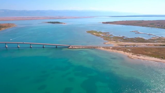 Aerial panorama view with bridge and sea around islands 4K
